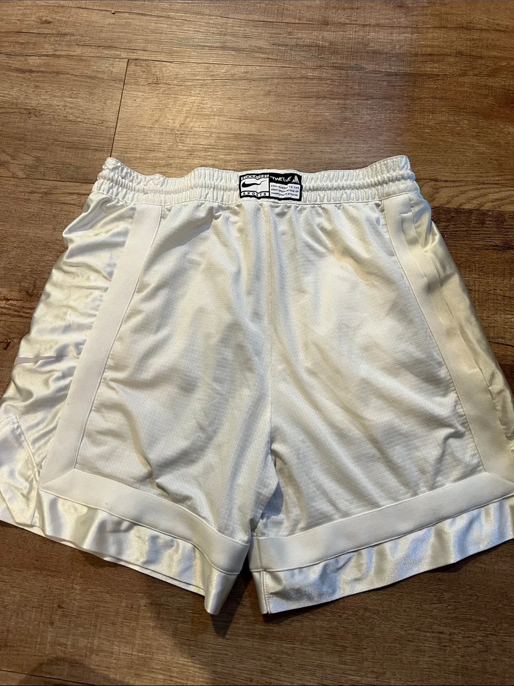 Nike Men’s White Athletic Shorts with Pale Pink Graphic
